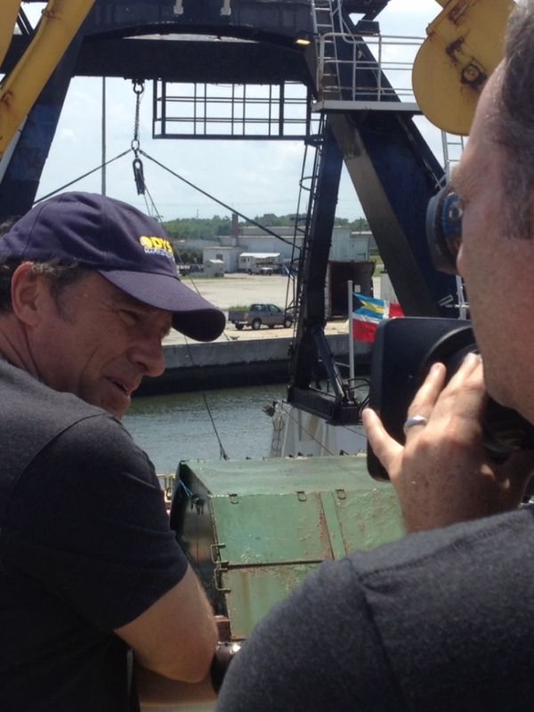 On location with a camera operator working on a boat